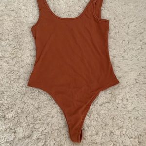 Rusty orange body suit